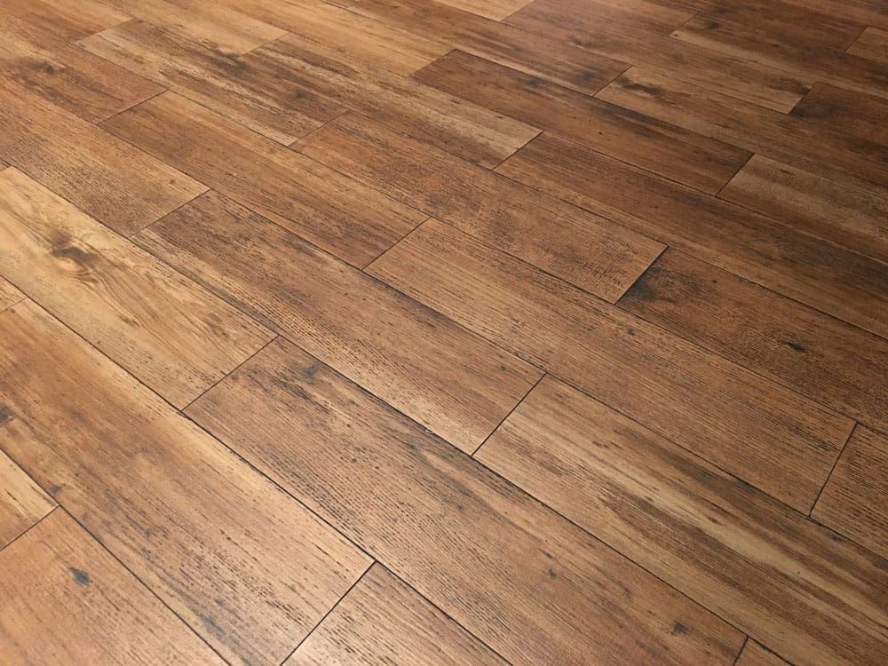 Top view of wooden panels and parquet on the floor in dark brown Houten vloeren Lisse